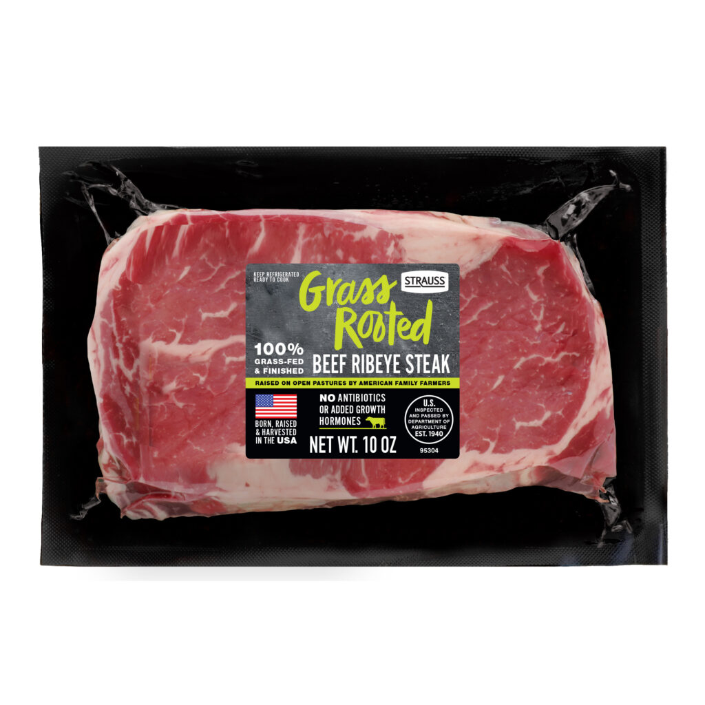 A vacuum-packed retail package of Strauss Grass Rooted 100% grass-fed and finished beef ribeye steak